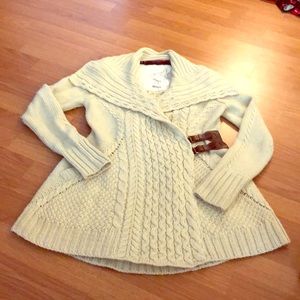 Ivory buckle cable-knit sweater - Anthropologie